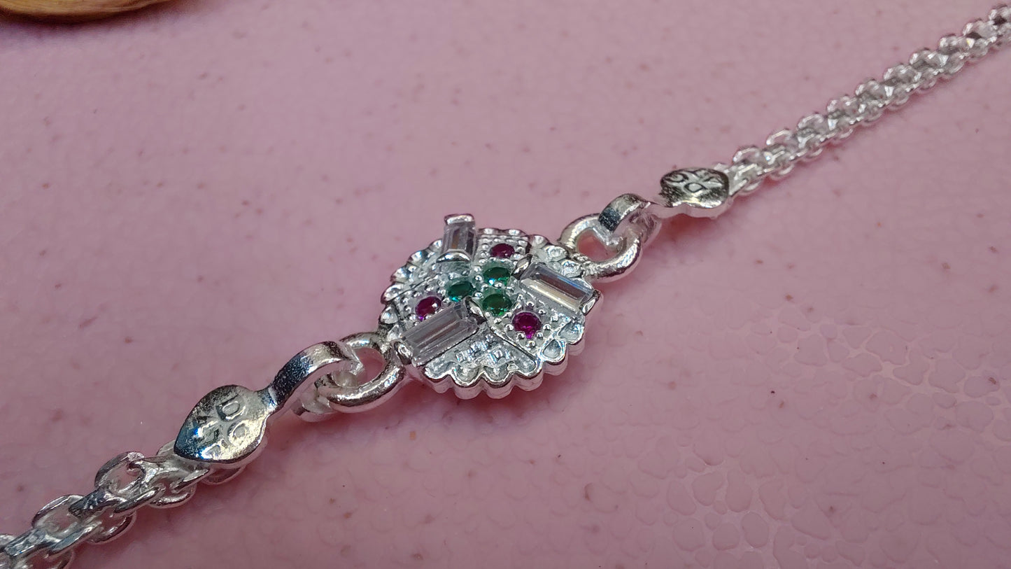 Regal Radiance Silver Rakhi Bracelet